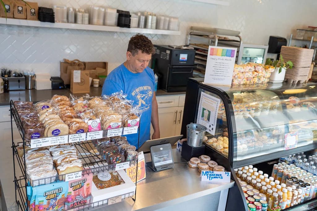 The pastry case and register, stocked for the morning